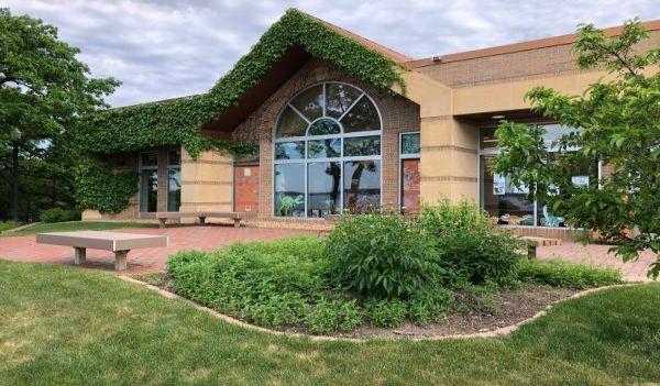 Buffalo library surrounded by a garden and trees
